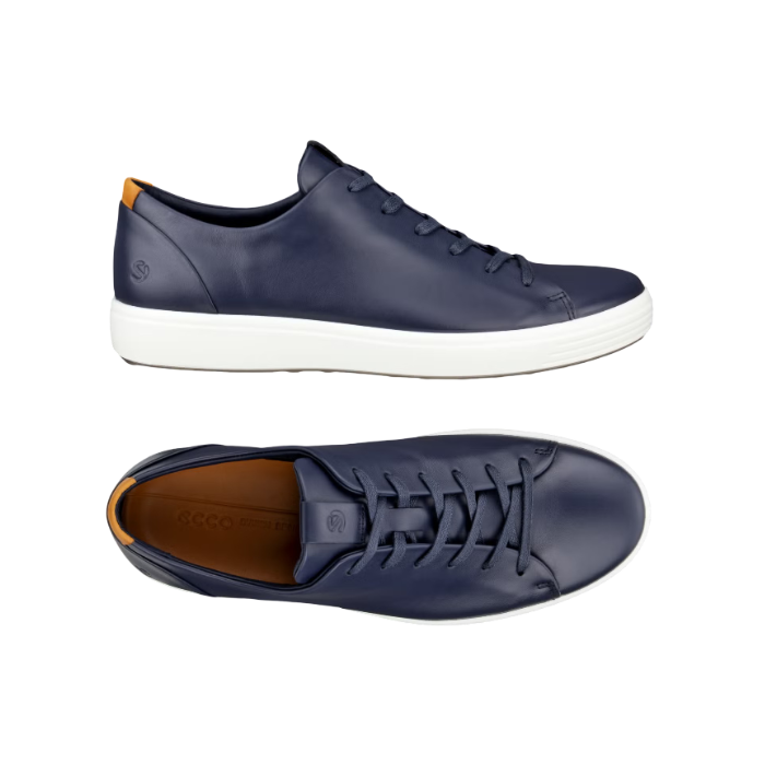 Pair of Navy blue sneakers with navy laces, tan leather ecco logo'd footbed, white midsole and beige outsole.