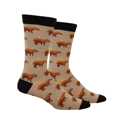 Beige socks with capybaras walking with oranges on their backs.