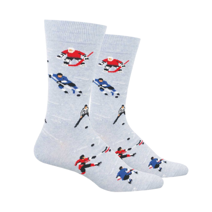 Light blue socks patterned with hockey goalies or skaters in red or blue uniforms and black and white shirt referees. 