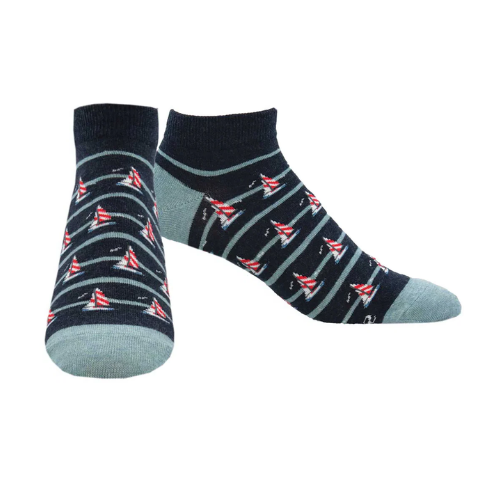 Two navy socks with sailboat pattern and accent light blue sections.