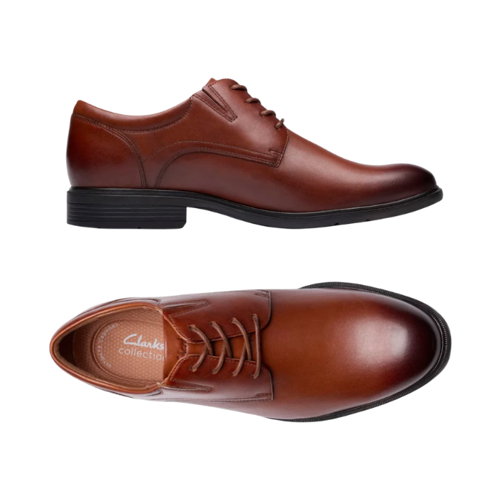 Pair of Brown derby dress shoes with burnished toe, detailed stitching, tan Clarks logo'd footbed and black outsole.