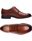 Pair of Brown derby dress shoes with burnished toe, detailed stitching, tan Clarks logo'd footbed and black outsole.