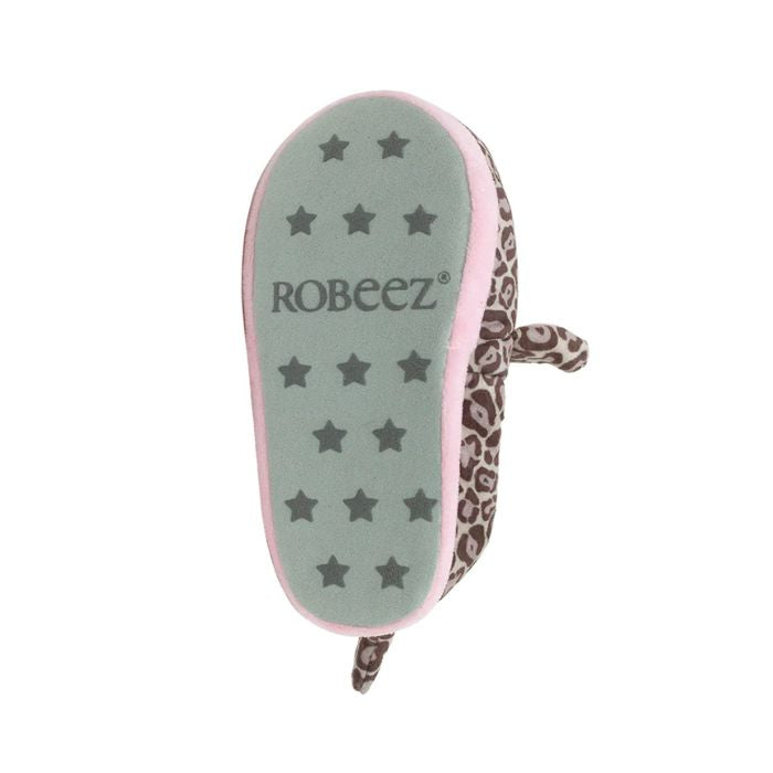 Grey outsole on leopard kids slipper with star pattern grips and Robeez logo in middle.