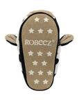  Beige outsole of cow slipper with star grip pattern and Robeez logo in middle.