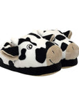 Pair of smiling cow slippers with 3D horns and ears and black midsole.