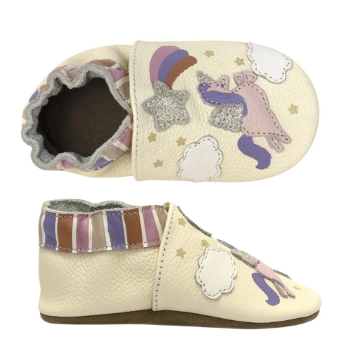 Pair of baby's ivory leather shoes with shooting star, unicorns in the sky pattern and striped cinched cuff.
