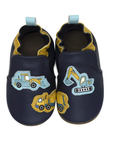 Top view of navy blue baby shoes with yellow accents and construction vehicle's on toe, cinched cuff and blue pull tab.