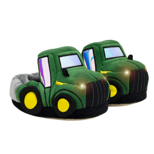 Green tractor-shaped slippers with working headlights.