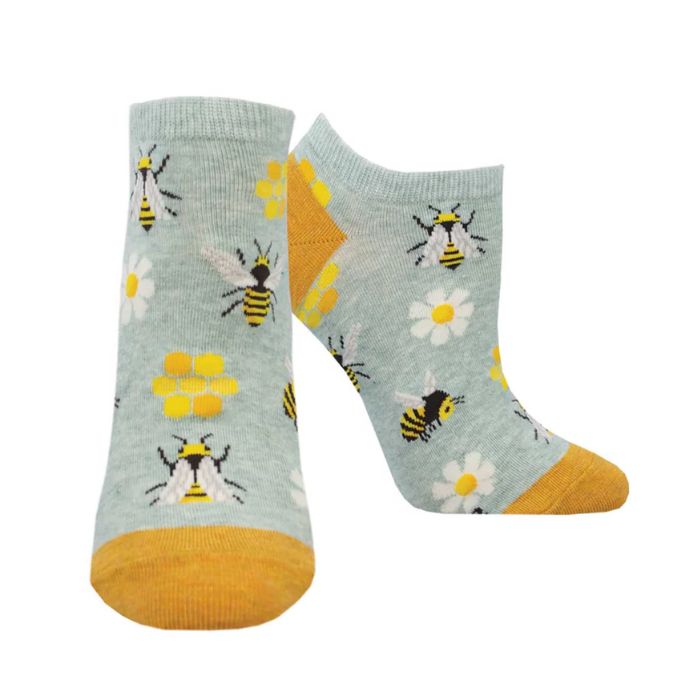 Pair of grey ankle socks with honey bees, hives and daisies with yellow heel and toe.