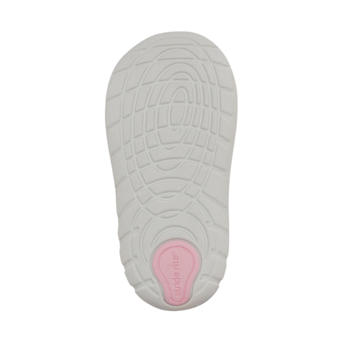 White Soft Motion outsole of toddler shoe with pink Stride Rite logo on heel.
