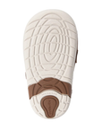 White rubber outsole with brown accents of a soft motion design and Stride rite logo on heel.