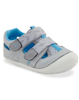 A light grey toddler sandal with two hook-and-loop straps, blue accents, blue lining and white outsole.