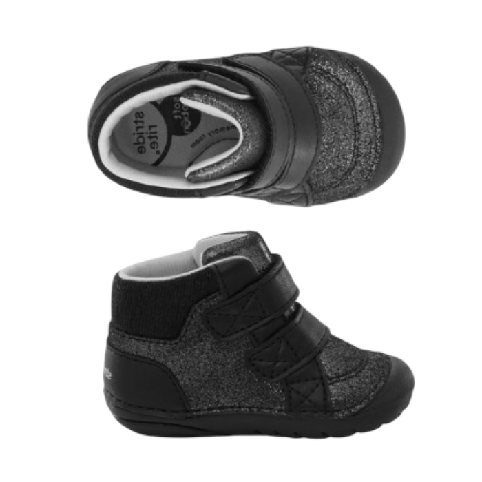 Pair of black high-top baby booties featuring a textured glittery black upper, a black knit ankle collar, grey Stride Rite logo'd footbed and two wide black hook-and-loop straps.
