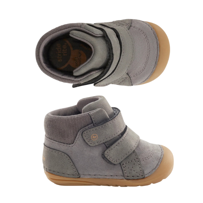 Pair of grey high-top baby booties with a grey knit ankle collar, two wide  hook-and-loop straps and crepe coloured outsole.