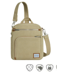 Natural beige canvas crossbody locking strap bag with two locking front zipper pockets, Travelon logo in corner, anti-theft feature icons across bottom.