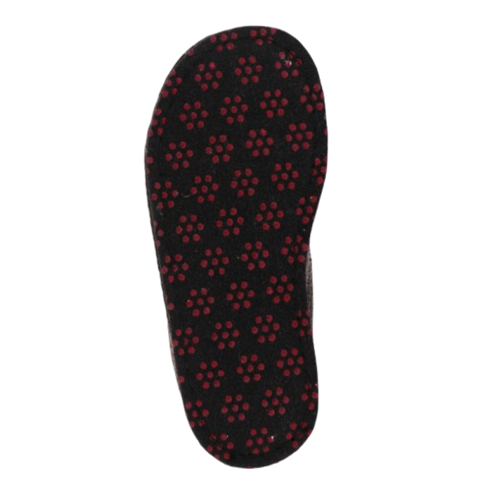 Outsole of a brown slipper with repeating pattern of small red circular dots (traction dots).