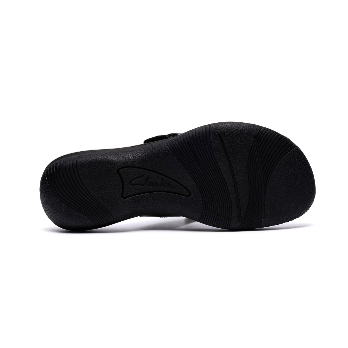 Black outsole of sandal with light wave tread pattern and Clarks logo in middle.