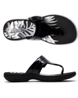 Pair of Black patent thong sandals with a black octagonal buckle, floral white Clarks logo'd footbed and black outsole.