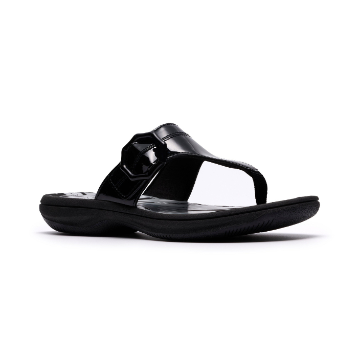 Black patent thong sandal with a black octagonal buckle, floral white footbed and black outsole.