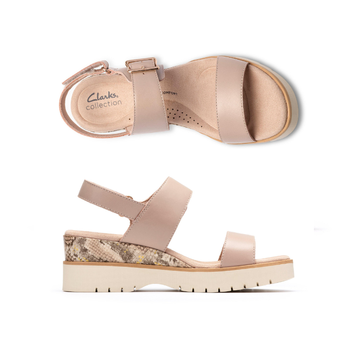 Pair of Beige platform wedge sandals with snake print accents, gold buckle detail, Velcro backstrap, tan Clarks logo'd footbed and light lugged outsole.