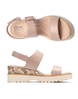 Pair of Beige platform wedge sandals with snake print accents, gold buckle detail, Velcro backstrap, tan Clarks logo'd footbed and light lugged outsole.
