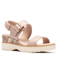 Beige platform wedge sandal with snake print accents, gold buckle detail, Velcro backstrap, tan Clarks logo'd footbed and light lugged outsole.