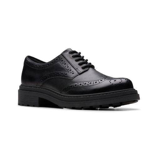 A black leather derby lace shoe with a chunky rubber outsole and intricate baroque details.