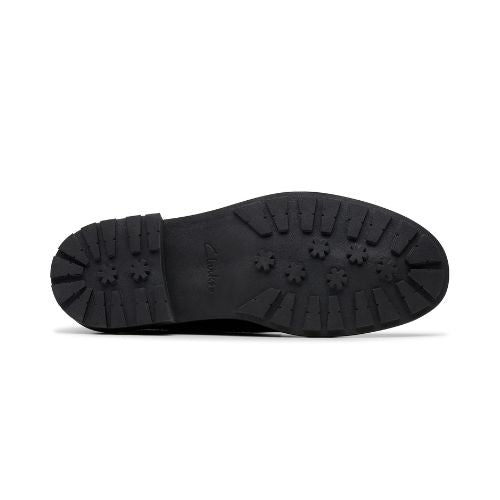 Black light treaded outsole with Clarks logo in middle.