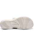 White outsole of sandal with light wave pattern tread and Clarks logo in middle.