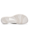 Light wave pattern treaded outsole of thong sandal with Clarks logo in middle.