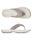 Pair of Silver thong sandals with multiple decorative straps covered in rhinestones, white Clarks logo'd footbed and thick cushioned outsole.