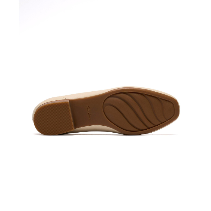 Light treaded wave pattern outsole with low block heel and Clarks logo stamped in middle.