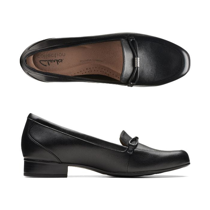 Black leather loafer with low heel and strap detailing on toe. Clarks logo on center of heel on insole.