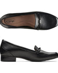 Black leather loafer with low heel and strap detailing on toe. Clarks logo on center of heel on insole.