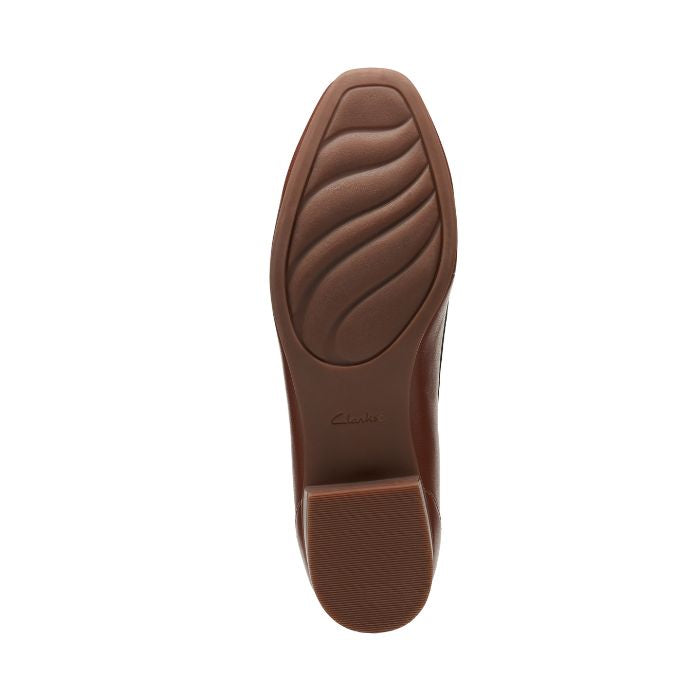 Brown rubber outsole with Clarks logo on center.