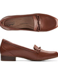 Black leather loafer with low heel and strap detailing on toe. Clarks logo on heel of brown insole.