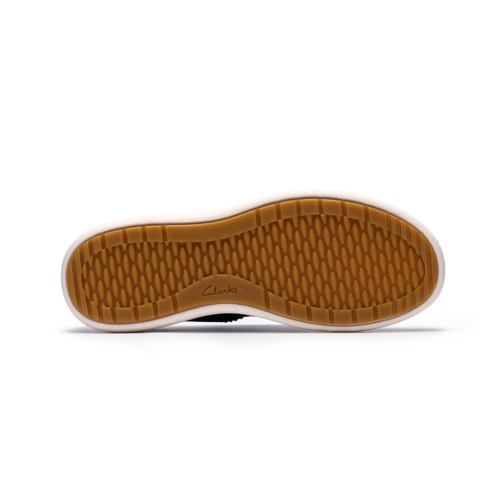 Tan light treaded outsole of sneaker with Clarks logo along side.
