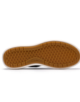 Tan light treaded outsole of sneaker with Clarks logo along side.