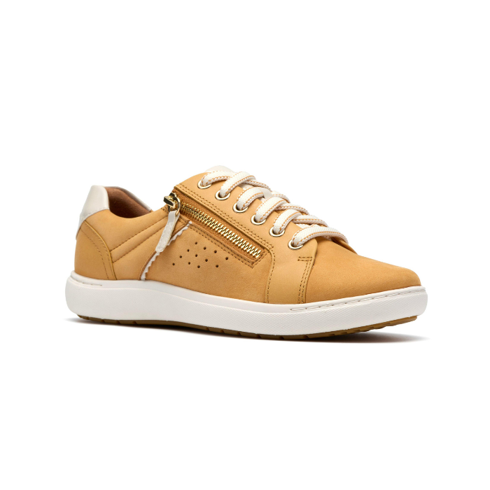 Yellow sneaker with gold side zipper, white laces, white heel accent, white midsole and brown outsole.