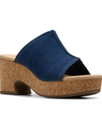 Clarks Nerisa Vine Heeled Sandal in denim blue with cork platform heel, ideal for stylish day-to-night wear.
