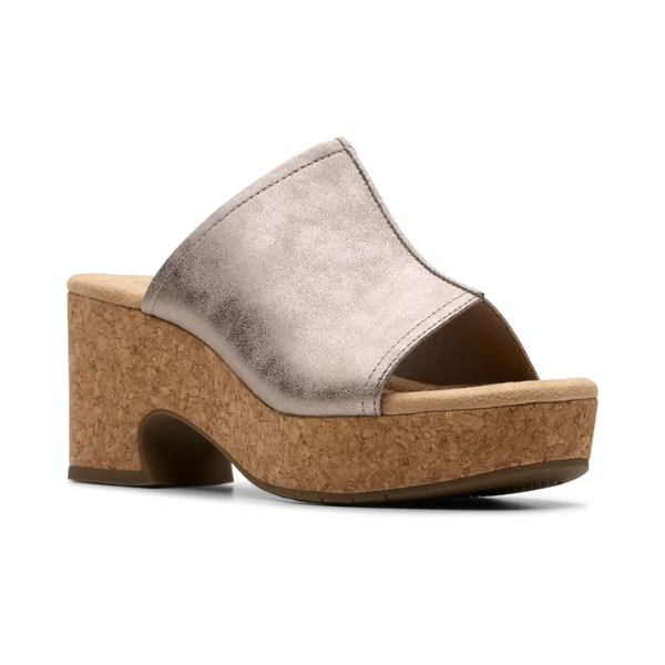Clarks Nerisa Vine Heeled Sandal in metallic silver with cork midsole, perfect for elevating casual or evening outfits.