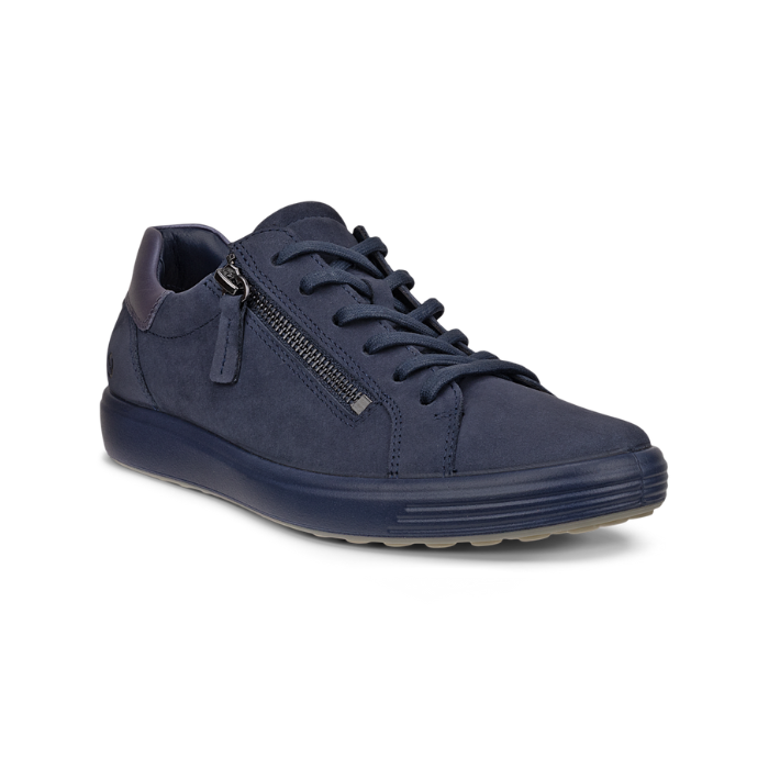 A navy blue nubuck lace sneaker with a side zipper, blue midsole and tan outsole.