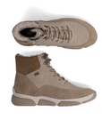 Pair of Light beige lace-up ankle bootswith darker beige accents, brown and beige treaded outsole and fur lining.