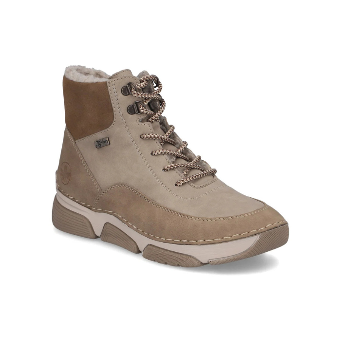 Light beige lace-up ankle boot with darker beige accents, brown and beige treaded outsole and fur lining.