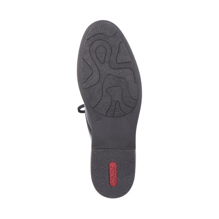 Black rubber outsole of women&#39;s oxford with red Rieker logo on heel.