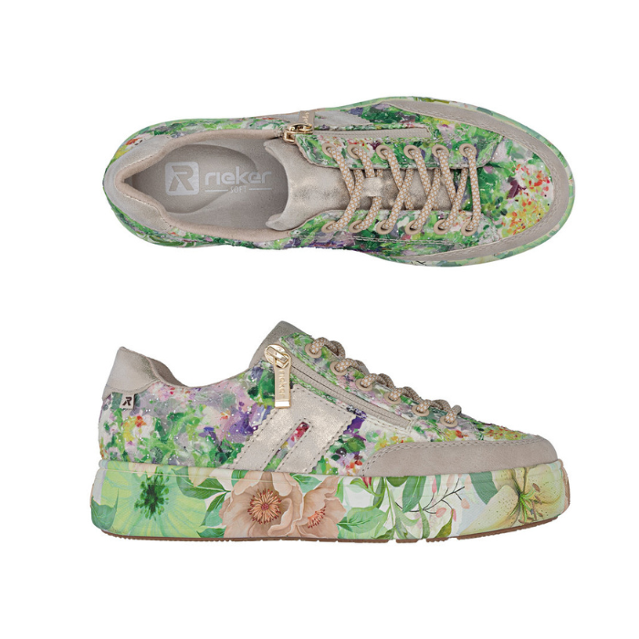 Pair of Green floral patterned sneakers with beige laces and accents, grey Rieker logo'd footbed and a floral patterned platform midsole. 