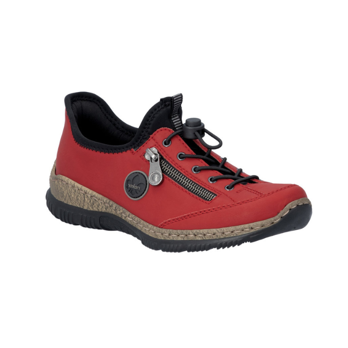 Red slip-on shoe with bungee laces, faux side zipper, Rieker logo in circle side emblem, brown faux cork midsole and a black outsole.