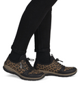 Leopard print bungee lace shoes worn with black pants.