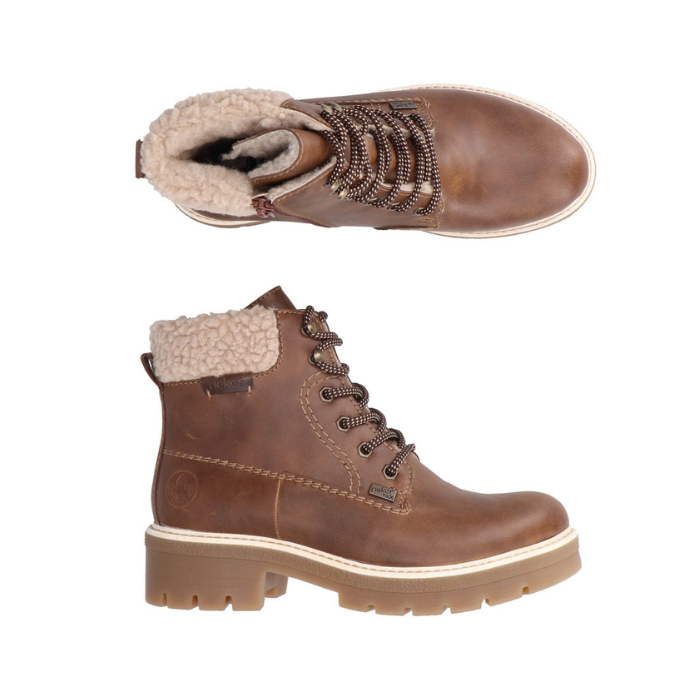 Pair of Brown faux leather ankle boots with beige fur fleece cuff, detailed light stitching, and a tan rubber lugged outsole