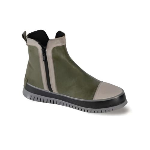 Olive Green ankle boot with black side zipper and beige accent toe cap and zipper lining with a black midsole and lugged grey outsole.